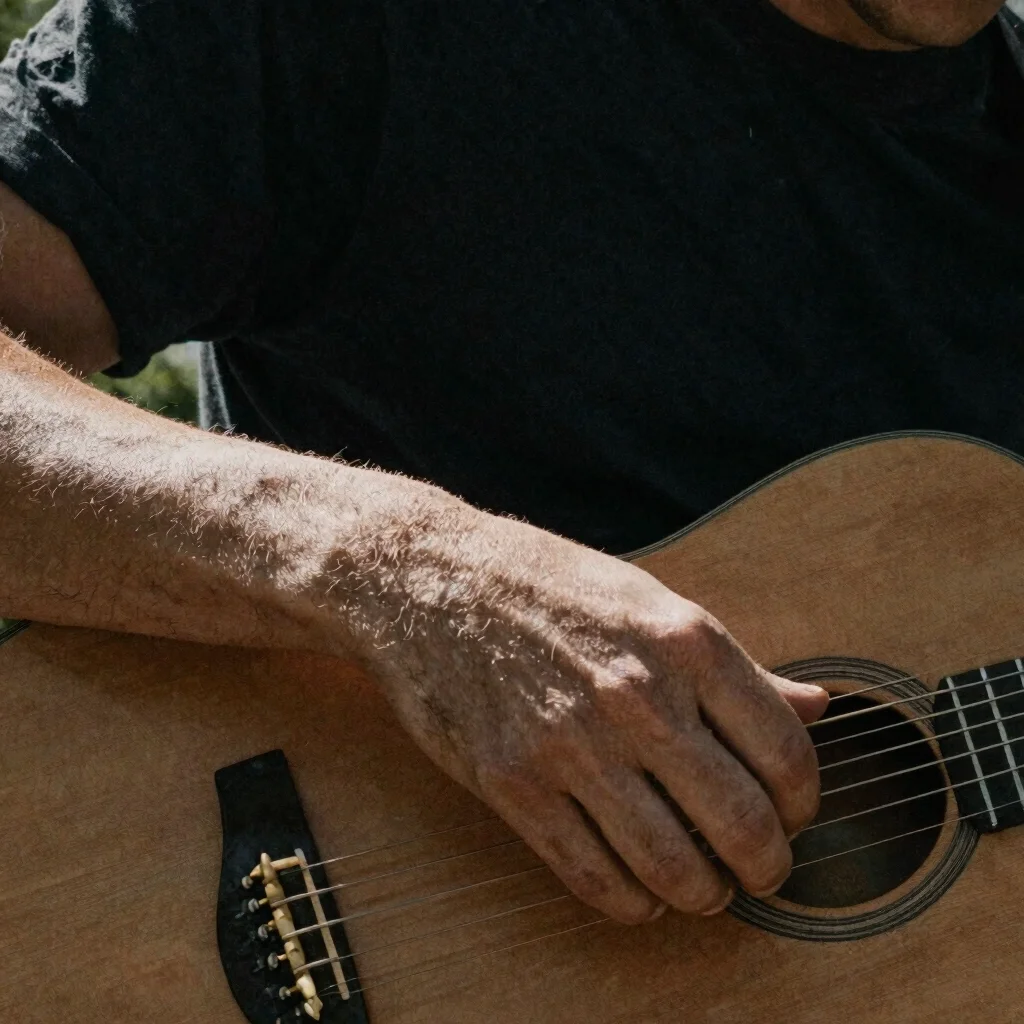 Intimate portrait detail of hands resting on a stringed instrumen